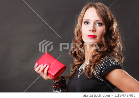elegant woman holding red handbag clutch bag elegant woman holding red handbag clutch bag 139472495