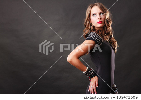 woman with jewellery in black evening dress woman with jewellery in black evening dress 139472509