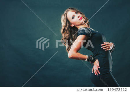 woman with jewellery in black evening dress woman with jewellery in black evening dress 139472512