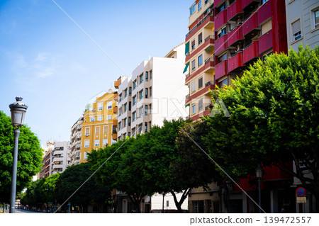 Colorful Residential Buildings Along Tree Lined Street Valencia Colorful Residential Buildings Along Tree Lined Street Valencia 139472557
