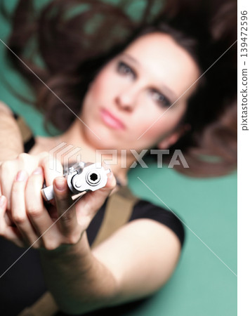 Sexy young woman long hair - gun Sexy young woman long hair - gun 139472596