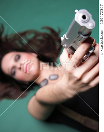Sexy young woman long hair - gun 139472597
