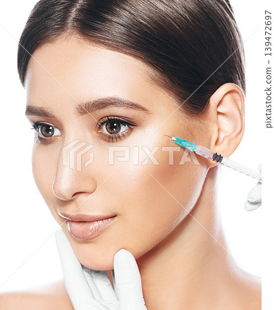 blocking facial wrinkles, botulinum toxin injections. Female face during a disport procedure 139472697