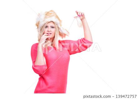 Attractive woman wearing furry winter hat Attractive woman wearing furry winter hat 139472757