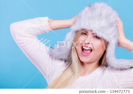 Blonde woman in winter furry hat Blonde woman in winter furry hat 139472773