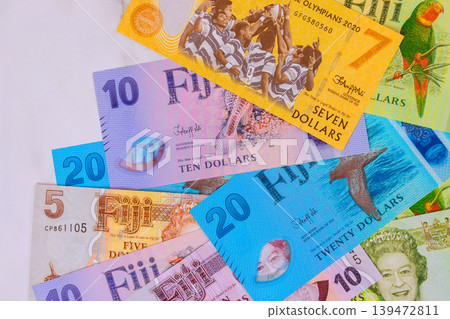 Different currency notes from Fiji dollar are arranged on various values designs. 139472811