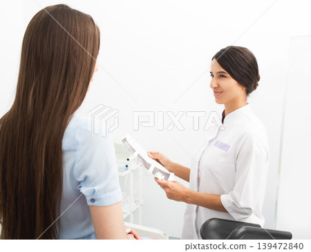 venous blood sampling for analysis. The nurse view the patient veins with the help of a special Vein scanner 139472840