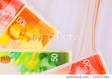 Several currency New Israeli shekel NIS banknotes in different denominations are arranged Several currency New Israeli shekel NIS banknotes in different denominations are arranged 139472989