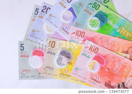 Different Maldivian rufiyaa currency notes arranged on flat surface for study purposes Different Maldivian rufiyaa currency notes arranged on flat surface for study purposes 139473077