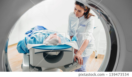 friendly doctor talking to patient . CT Scan in hospital 139473534