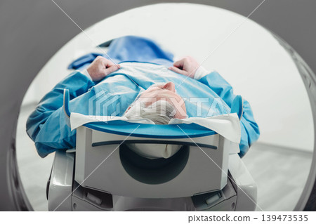 Senior patient at a computer tomography exam Senior patient at a computer tomography exam 139473535