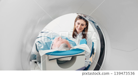 friendly doctor talking to patient . CT Scan in hospital 139473536