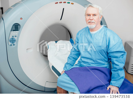 senior man sitting on scanner table. waiting for CT scan 139473538