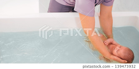teaches infant baby to swim. Aquatic therapy for infant baby teaches infant baby to swim. Aquatic therapy for infant baby 139473932