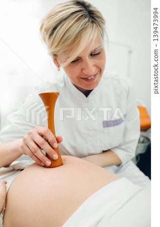 pregnant woman having exam by her obstetrician. prenatal care pregnant woman having exam by her obstetrician. prenatal care 139473994