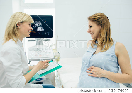 pregnant woman consultation with her obstetrician. Prenatal preparing pregnant woman consultation with her obstetrician. Prenatal preparing 139474005
