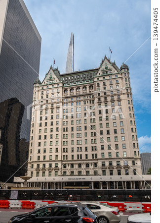 New york, usa august 17,2024. The iconic plaza hotel standing on fifth avenue, featuring its classic architecture with an emerging modern skyscraper in the background New york, usa august 17,2024. The iconic plaza hotel standing on fifth avenue, featuring its classic architecture with an emerging modern skyscraper in the background 139474405