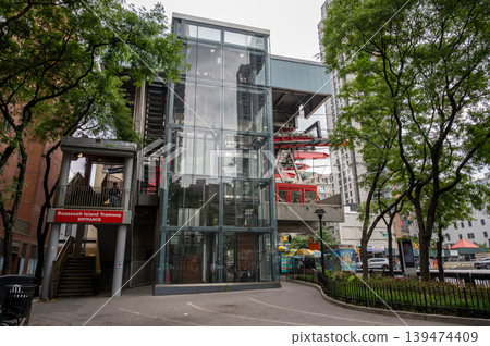New york, usa august 17,2024. Roosevelt island tramway station displaying entrance signage and modern glass architecture, offering urban transport in new york city New york, usa august 17,2024. Roosevelt island tramway station displaying entrance signage and modern glass architecture, offering urban transport in new york city 139474409