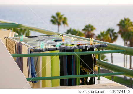 Beach Balcony Laundry Drying Rack at Sunset with Ocean View Beach Balcony Laundry Drying Rack at Sunset with Ocean View 139474460