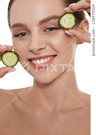 Cucumber mask for female smooth skin face. Skin care with cucumbers 139474504