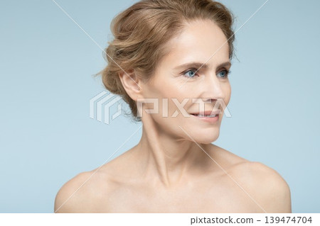 Middle-aged woman after skin tightening and anti-aging procedures. Female beauty in age 139474704