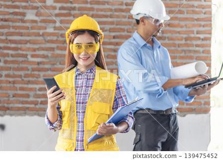 construction business plan deconstruction team consulting partnership. Construction engineer teamwork Safety Suit Trust Team implement honest planning in Construction Site. Trustworthy engineer team. 139475452