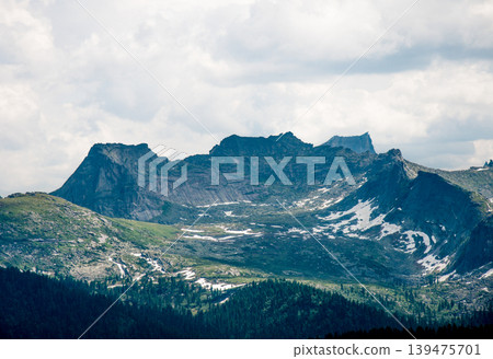 Landscape of Siberia Ergaki mountains, mountain range in haze summer Landscape of Siberia Ergaki mountains, mountain range in haze summer 139475701