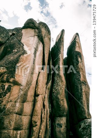 Landscape of Siberia mountains Stolbi, rock Feathers range in haze summer Landscape of Siberia mountains Stolbi, rock Feathers range in haze summer 139475729
