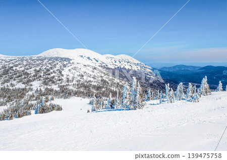 Landscape of snowy Sheregesh mountains, mountain range haze winter Bird eye view Landscape of snowy Sheregesh mountains, mountain range haze winter Bird eye view 139475758