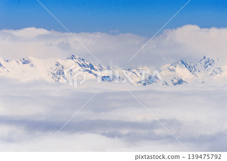 Landscape of snowy Russia Sochi mountains, peaks in haze winter Krasnaya Polyana Landscape of snowy Russia Sochi mountains, peaks in haze winter Krasnaya Polyana 139475792