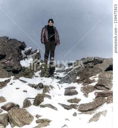 A vintage portrait of a young female skier on a mountaintop. Retro photo from 1985. A vintage portrait of a young female skier on a mountaintop. Retro photo from 1985. 139475923