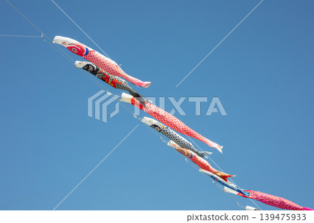 Carp streamers fluttering vigorously under the clear May sky. 139475933