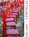 Rows of red chairs arranged outdoors for event, chairs prepared for audience, meeting, seminar, ceremony, presentation, festival. Concept of chair seating, organization, gathering, public ceremony 139476134