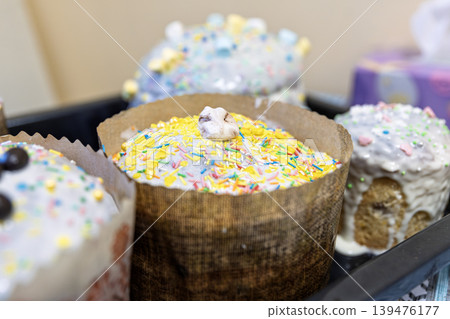 Traditional Easter Paska Cake with Yellow Topping and Colorful Sprinkles Traditional Easter Paska Cake with Yellow Topping and Colorful Sprinkles 139476177