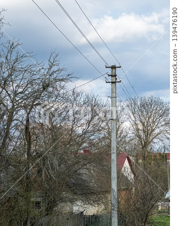 Concrete Electric Pole with Power Lines in a Rural Ukrainian Village Concrete Electric Pole with Power Lines in a Rural Ukrainian Village 139476190