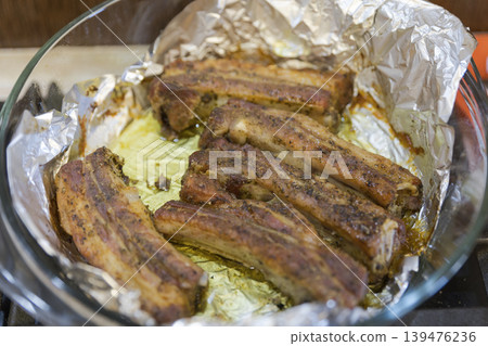 Baked Pork Ribs with Spices in a Glass Casserole Dish Baked Pork Ribs with Spices in a Glass Casserole Dish 139476236