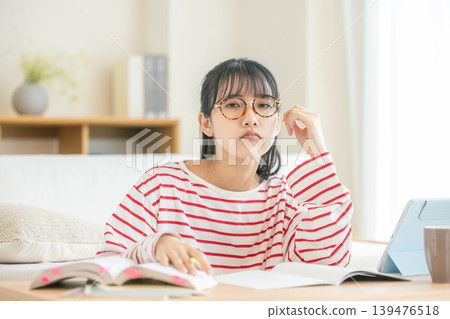 woman tired of studying woman tired of studying 139476518