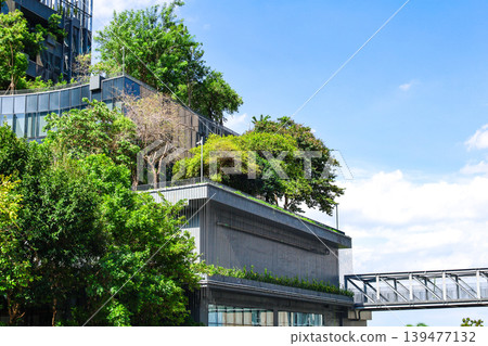 A landscape with many green spaces and modern buildings. A landscape with many green spaces and modern buildings. 139477132