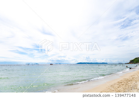 A beach with a wide expanse of blue ocean 139477148
