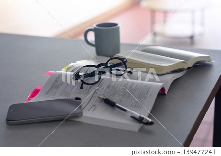 Text and glasses placed on the table 139477241