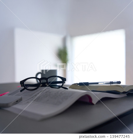 Text and glasses placed on the table Text and glasses placed on the table 139477245
