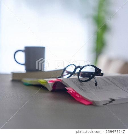 Text and glasses placed on the table Text and glasses placed on the table 139477247