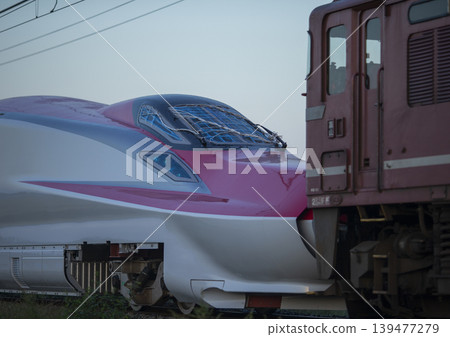 Shinkansen running in the morning sun Shinkansen running in the morning sun 139477279