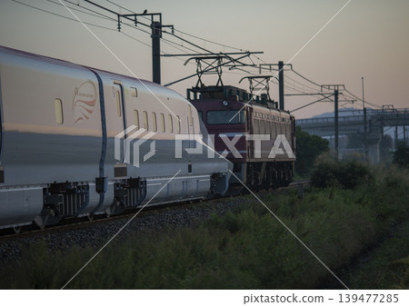 Shinkansen running in the morning sun Shinkansen running in the morning sun 139477285