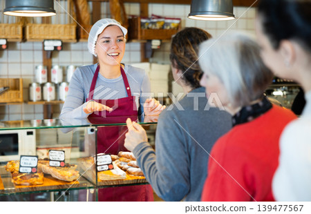 People place order at bakery, buy sweet pastries in cafeteria, girl worker serving people 139477567