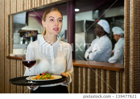 Portrait of waitress ready to serving meals 139477621
