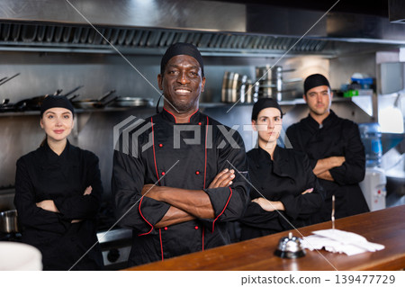 Team of chefs with man head chef Team of chefs with man head chef 139477729