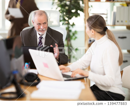Office employee working with laptop or computer, negotiating, calling with partners 139477883