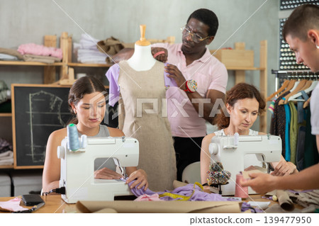 Group of students participating dressmaking class in tailor workshop Group of students participating dressmaking class in tailor workshop 139477950