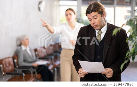male inexperienced new employee is upset because of boss s scolding male inexperienced new employee is upset because of boss s scolding 139477985